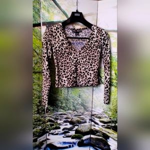 Polly & Esther animal print long sleeve top.